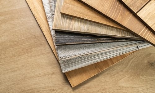 Stack of various construction sample wood boards.